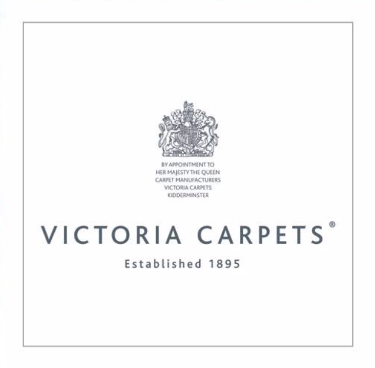 Logo of Victoria Carpets, established 1895, featuring a royal crest and the text "By appointment to Her Majesty the Queen Carpet Manufacturers Victoria Carpets Kidderminster," showcasing their legacy in carpet craftsmanship.